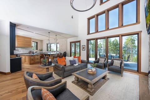 The open concept living space seamlessly integrates the kitchen, living and dining areas.