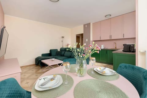 The round dining table invites shared meals and conversations, with carefully selected accessories emphasizing attention to detail.