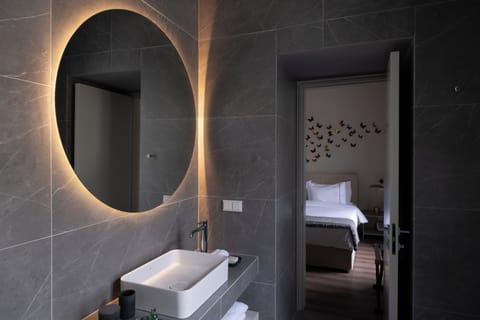 Suite, City View | Bathroom | Shower, designer toiletries, hair dryer, bathrobes