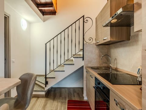 Property, Cabinetry, Wood, Countertop, Stairs, Floor, Flooring, Interior Design, Sink, Wood Stain