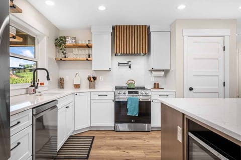Enjoy this gourmet chef's kitchen with amenities such as an electric range, Instant Pot, blender, air fryer, crock pot and high end cookware.