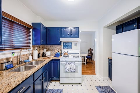 Whip up your favorite dishes in this full kitchen with plenty of supplies.