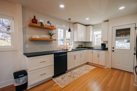 The large kitchen is located next to the living room so that no-one has to miss out on the fun!