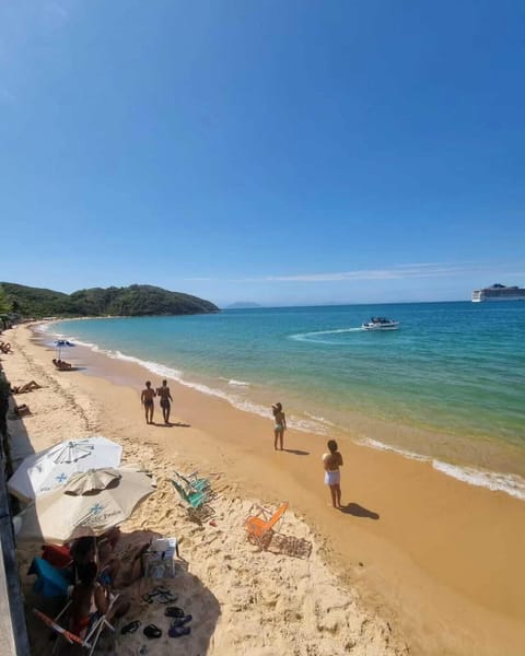 On the beach, white sand, beach umbrellas, beach bar