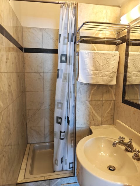 Triple Room | Bathroom | Shower, hair dryer, towels, soap