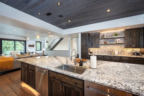 The kitchen is equipped with high end appliances, including 2 dishwashers.