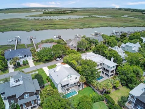 Experience the tranquility of nearby homes nestled amidst lush nature and serene water views.