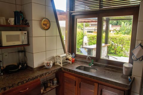 Villa | Private kitchen | Fridge, microwave, oven, blender