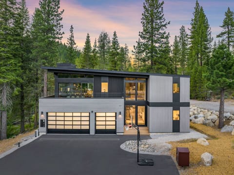 Exterior: Front view of this luxury home, upper deck, garage, located 4 minutes from Palisades Tahoe and 7 minutes to Alpine Meadows and Tahoe City.