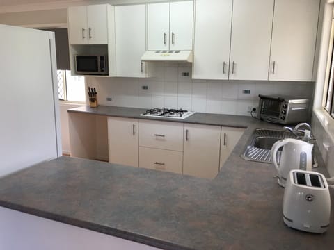 Apartment, Multiple Beds | Private kitchen | Full-size fridge, microwave, oven, dishwasher