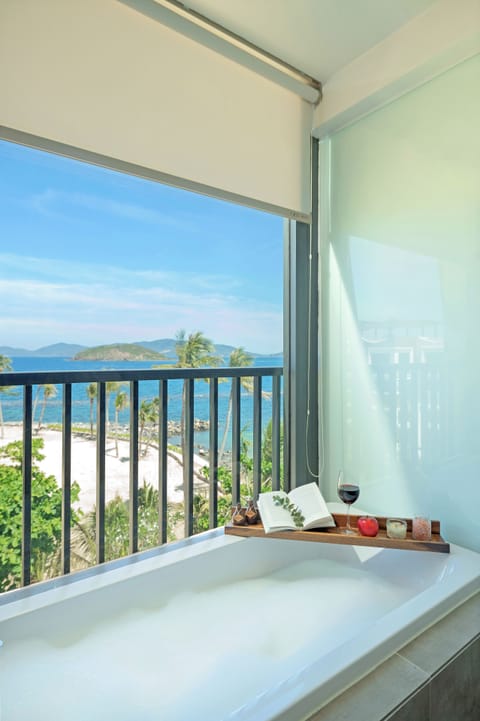 Family Apartment, Ocean View | Bathroom | Combined shower/tub, rainfall showerhead, hair dryer, bathrobes