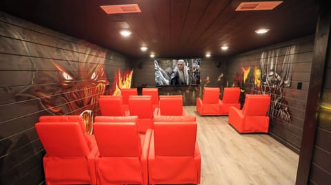 Step into Smaug’s lair with this epic theater room! 