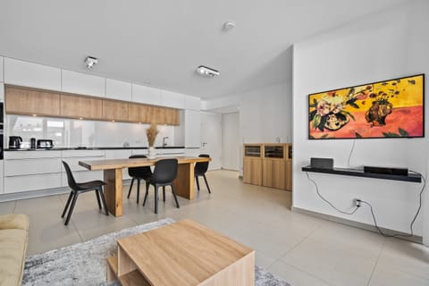 Enjoy the spacious and modern open-plan living and dining area, perfect for relaxing and entertaining in style.