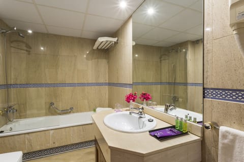 Bathtub, deep soaking tub, eco-friendly toiletries, hair dryer