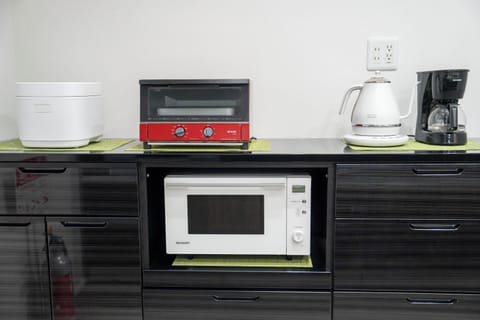 Full-size fridge, microwave, stovetop, electric kettle