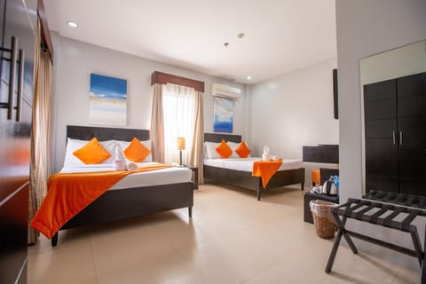 Family Room, 2 Double Beds | Minibar, in-room safe, desk, free WiFi