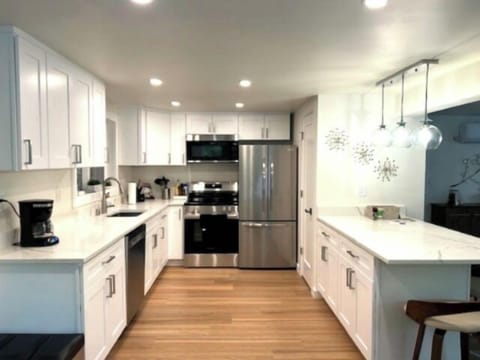 - Spacious kitchen with stainless steel fridge and oven  
- Plenty of counter space for cooking and entertaining  
- Well equipped setup designed for guest convenience  
