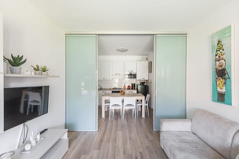 Apartment | Living area | 35-inch flat-screen TV with satellite channels