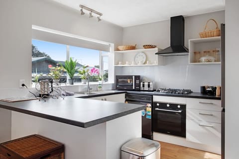 The kitchen has been modernised with a black and white colour scheme.