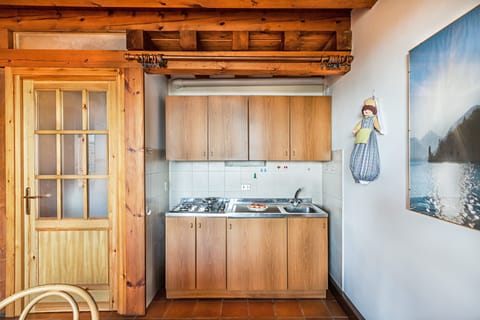 Apartment, Pool View | Private kitchen | Fridge, microwave, stovetop, electric kettle