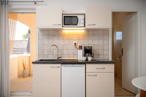 Studio, Sea View, Beachfront | Private kitchen | Mini-fridge, highchair, cookware/dishes/utensils