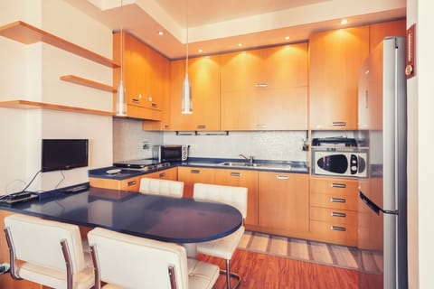 Apartment, Sea View | Private kitchen | Highchair