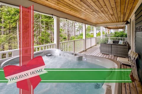 The hot tub sits 6, and sits on the lower balcony of the home.