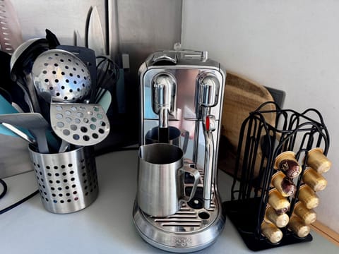 Nespresso coffee pod machine with milk frothing function.
