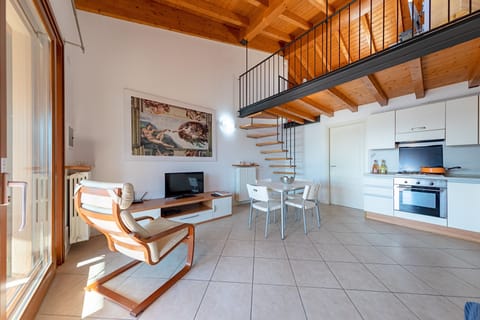 Apartment, Pool View | Living area | 35-cm TV with digital channels