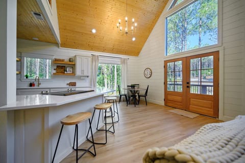 This view shows the dining are and the extra seating along the kitchen island.