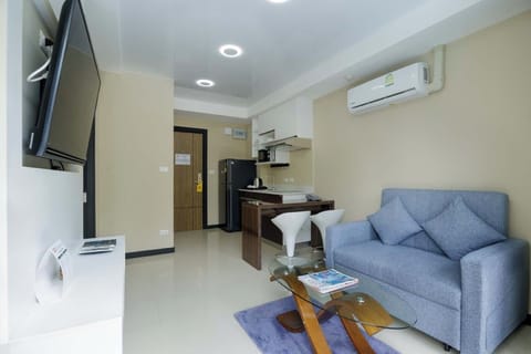 Exclusive Apartment | Living area | 50-inch Smart TV with satellite channels