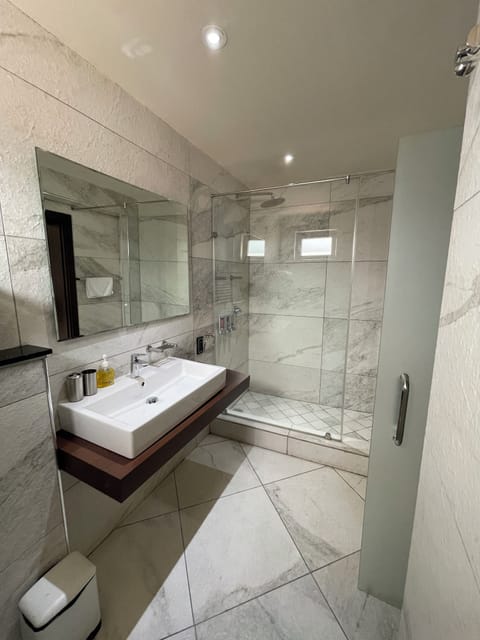 Superior Double Room Single Use, Balcony, City View | Bathroom | Shower, rainfall showerhead, hair dryer, slippers