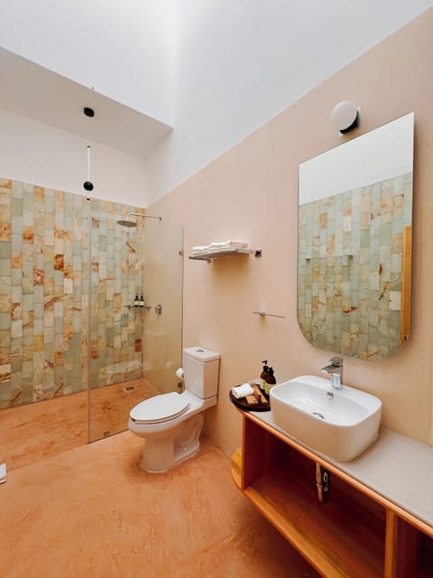 Grand Suite, Balcony, City View | Bathroom | Shower, rainfall showerhead, hair dryer, bathrobes