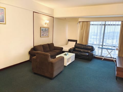 Family Apartment, 2 Bedrooms | Living area | 32-inch TV with cable channels, fireplace