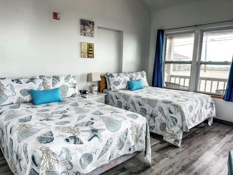 Room, 2 Double Beds, Ocean View | Individually decorated, individually furnished, iron/ironing board