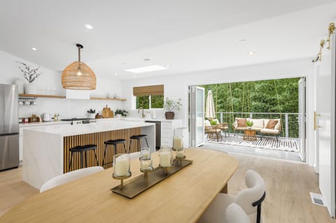 Savor a meal and the fresh air coming through the bifold patio door.