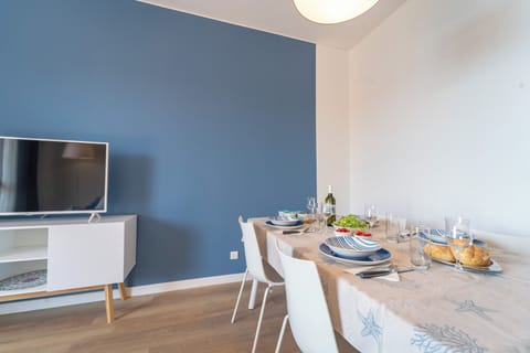 Apartment, Sea View | Living area | 35-inch TV with digital channels