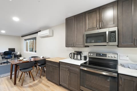 A spacious kitchen blends seamlessly with a cozy dining area—ideal for cooking and connecting in one inviting space.