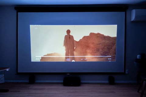 Lights down, screen glowing—immerse yourself in a true movie-night experience with HD projection, Google TV, and rich, theater-quality sound, all from the comfort of your room.