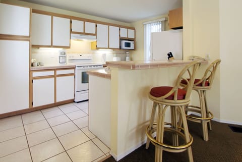 One Bedroom Suite | Private kitchen | Fridge, microwave, coffee/tea maker