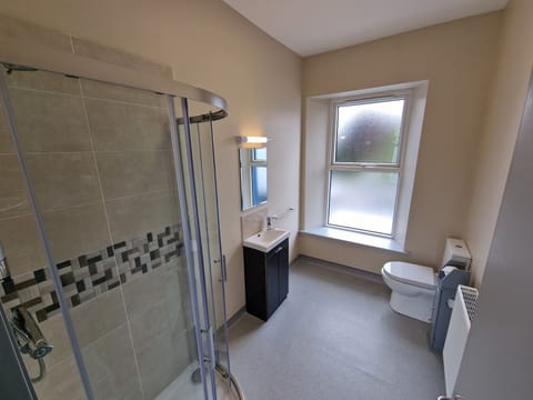 Shower, rainfall showerhead, hair dryer, towels