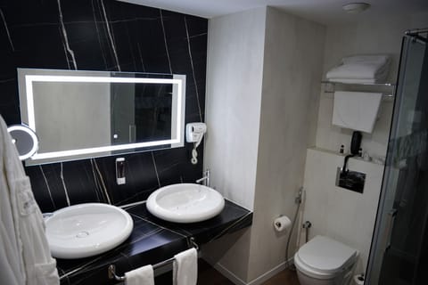 Junior Suite, Non Smoking, City View | Bathroom | Rainfall showerhead, hair dryer, bathrobes, slippers