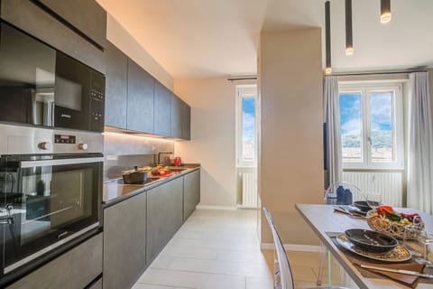 Standard Apartment, 2 Bedrooms (Viktor House Salò - 100m near lake) | Private kitchen | Fridge, microwave, stovetop, dishwasher