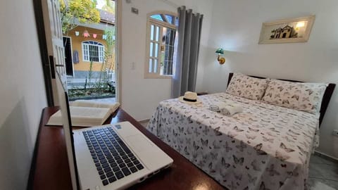 Comfort Suite, Balcony, Courtyard View | Desk, laptop workspace, blackout drapes, iron/ironing board