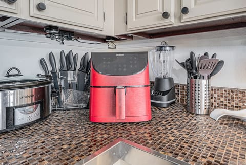 - Make snack time easy with a bright red air fryer, blender, and slow cooker at your fingertips
- Tackle any recipe with a full knife set and modern kitchen tools within reach
- Enjoy a fully equipped setup that’s perfect for home cooked meals and quick bites