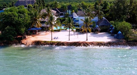 On the beach, white sand, free beach cabanas, beach shuttle