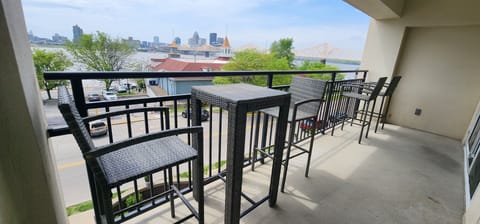 Large balcony overlooking Ohio River and Louisville downtown skyline