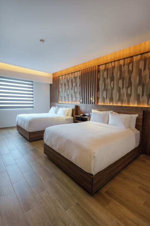 Junior Suite, 2 Queen Beds, Non Smoking | Premium bedding, in-room safe, individually decorated