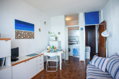 Family Apartment, Multiple Bedrooms (Sole Surf E Relax) | Living area | 21-inch flat-screen TV with cable channels, TV