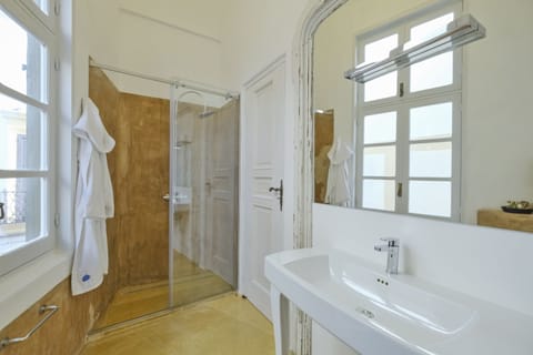 Deluxe Suite, Balcony, Partial Sea View | Bathroom | Hair dryer, slippers, towels, soap